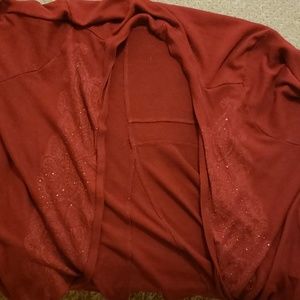 A maroon colored cardigan